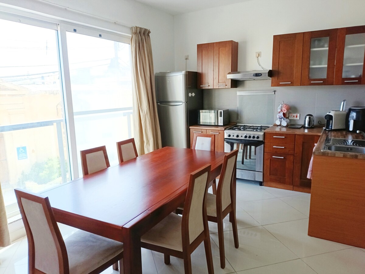 Cozy private bedroom with workspace