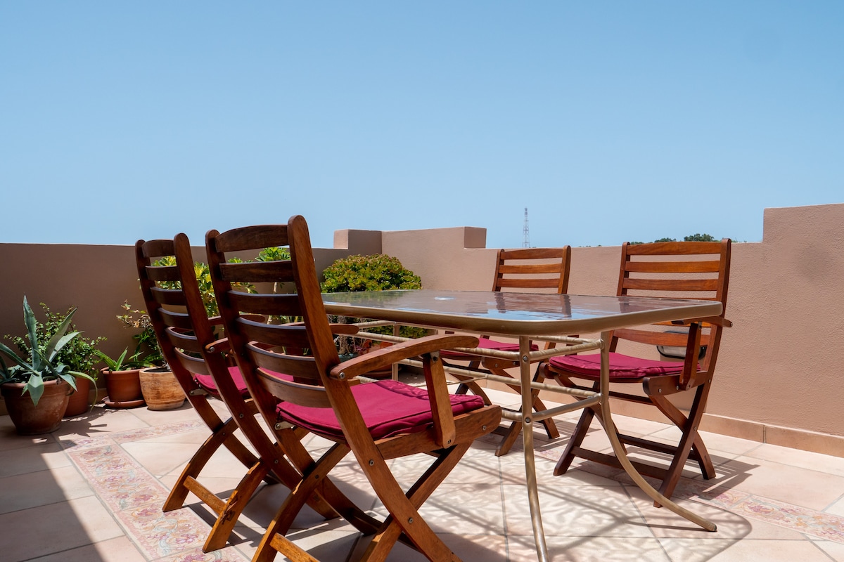 In a penthouse, private, quiet, airy & bright.