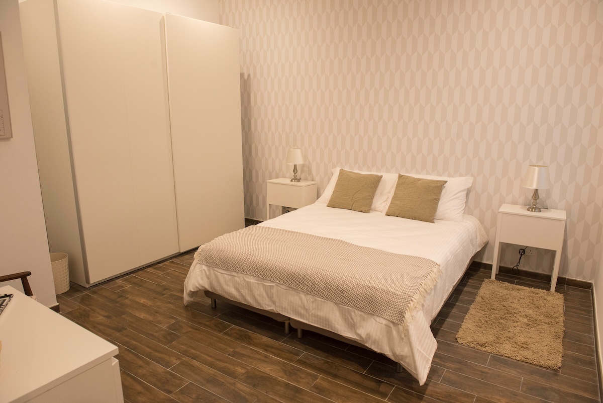 Modern large double bedroom with private bathroom