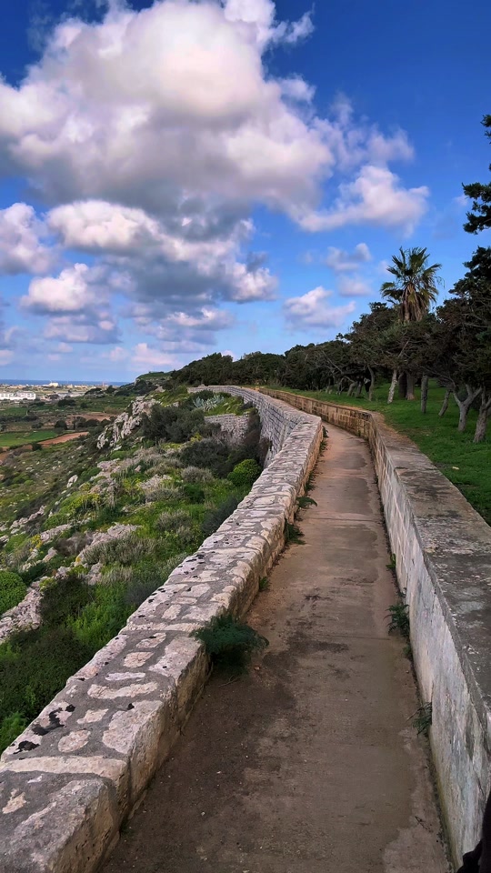 Hiking the Victoria Lines of Malta 🇲🇹❤️🌍 The Victoria Lines were built by the British military between 1875-1899 as a 12km long defensive wall fortification. They divide the island on a natural fault line, dividing the island north from south. 🤔 The historic path runs from Madliena in the east, through Mosta, and to the limits of Rabat on the west coast. ☀️  Malta has a lot of great places to explore, and the winter brings the rainy season, which brings the green back to the islands. 🌱 If you're visiting Malta, I suggest the off-peak seasons, between October through April. This is the best weather to be outdoors all day, especially if you're a hiker. 🥾 I've walked every single meter of all three islands, and I can tell you that hiking the coastline is beautiful in spring. 😍  Wherever you visit, please remember... 🙏 Always make sure to leave no trace behind. Respect the people, respect the Islands.
